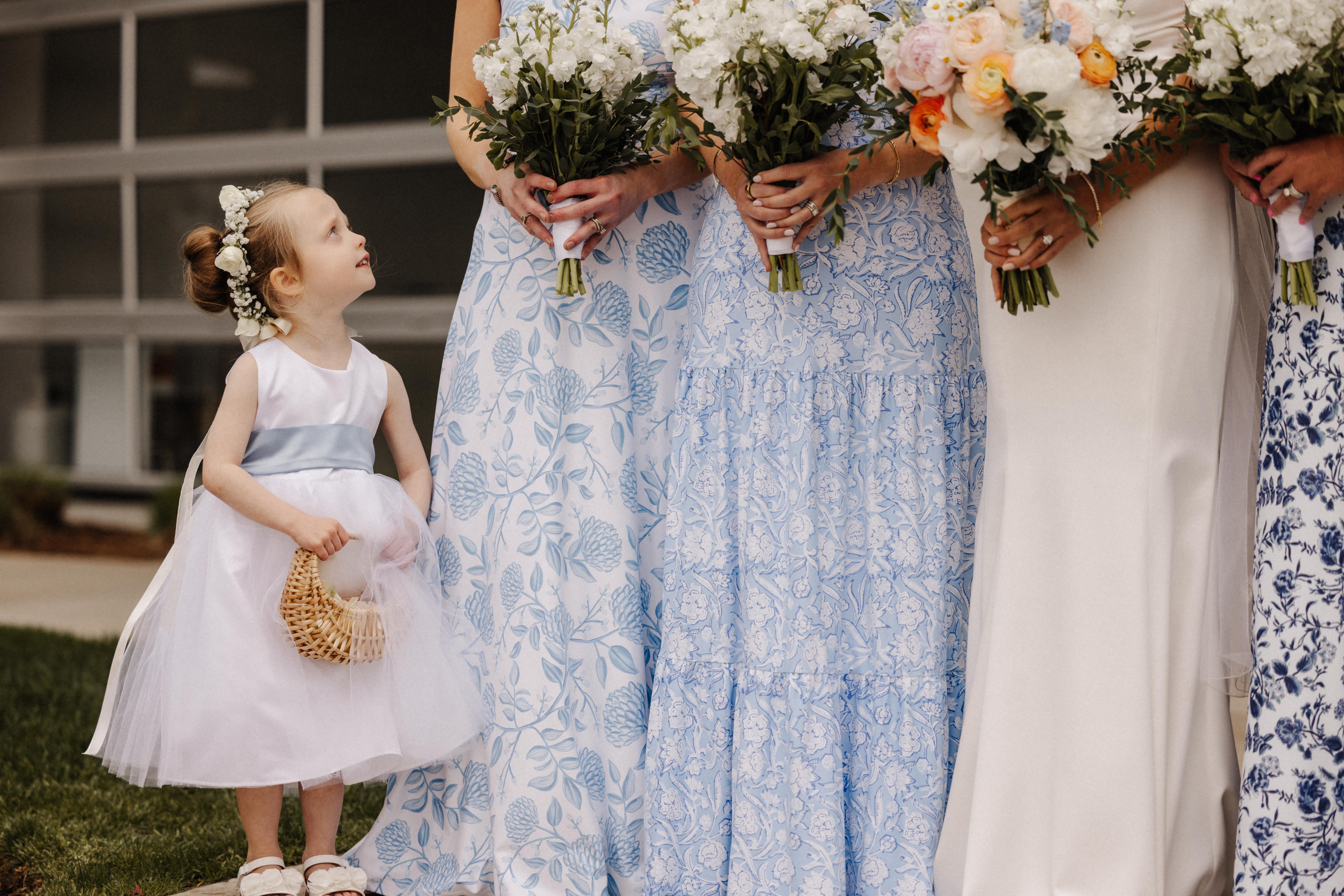 Flower girl and bridesmaids in a candid moment, documentary wedding photographer Honey & Bloom Photography Central New York